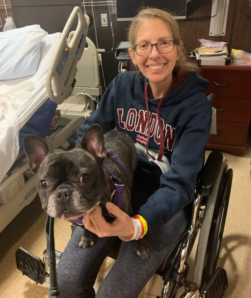 Angie Loving and her dog, Rigby. Loving was discharged from the hospital after five weeks. (Photo courtesy of Angie Loving)