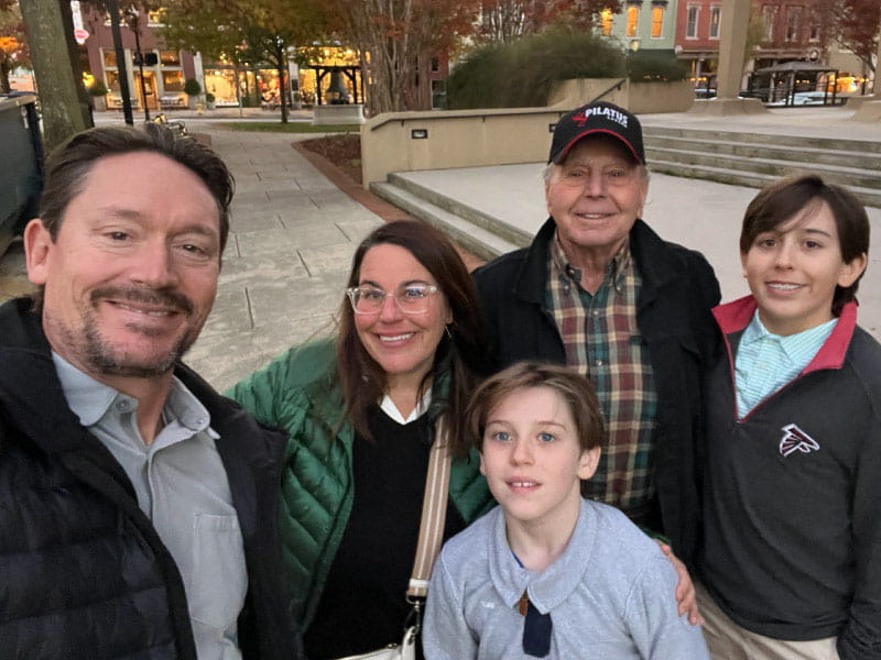 Becky Engram, second from left, with husband Derek, left, her father, Bruce Dunning, and sons Carter and Hudson, right, around Thanksgiving last year. Engram is part of the sandwich caregiver generation, being a parent to her boys while also caring for Dunning, who has heart issues.