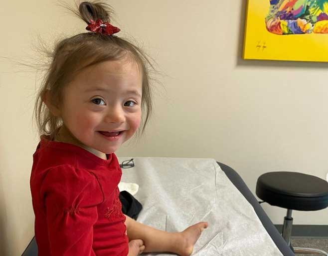 Ariel sitting on exam table at doctor office