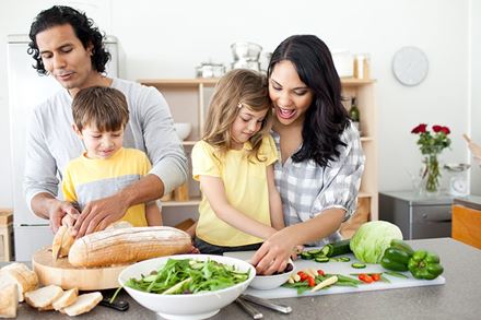 family cooking in kitchen