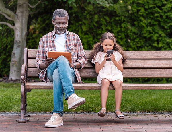 grandfather and child on bench