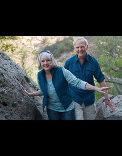 Couple hiking through a park