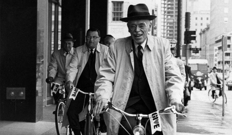 historical image of Paul Dudley White riding a bicycle