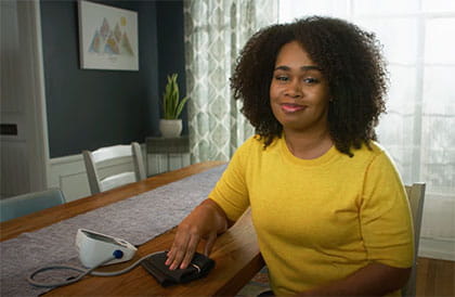 woman measuring blood pressure at home