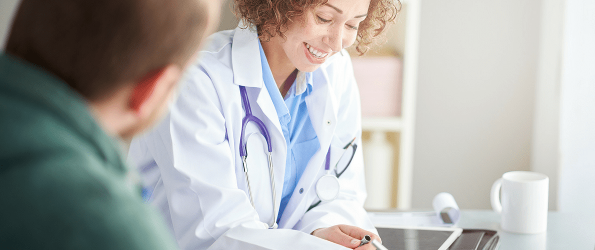 female doctor talking to patient